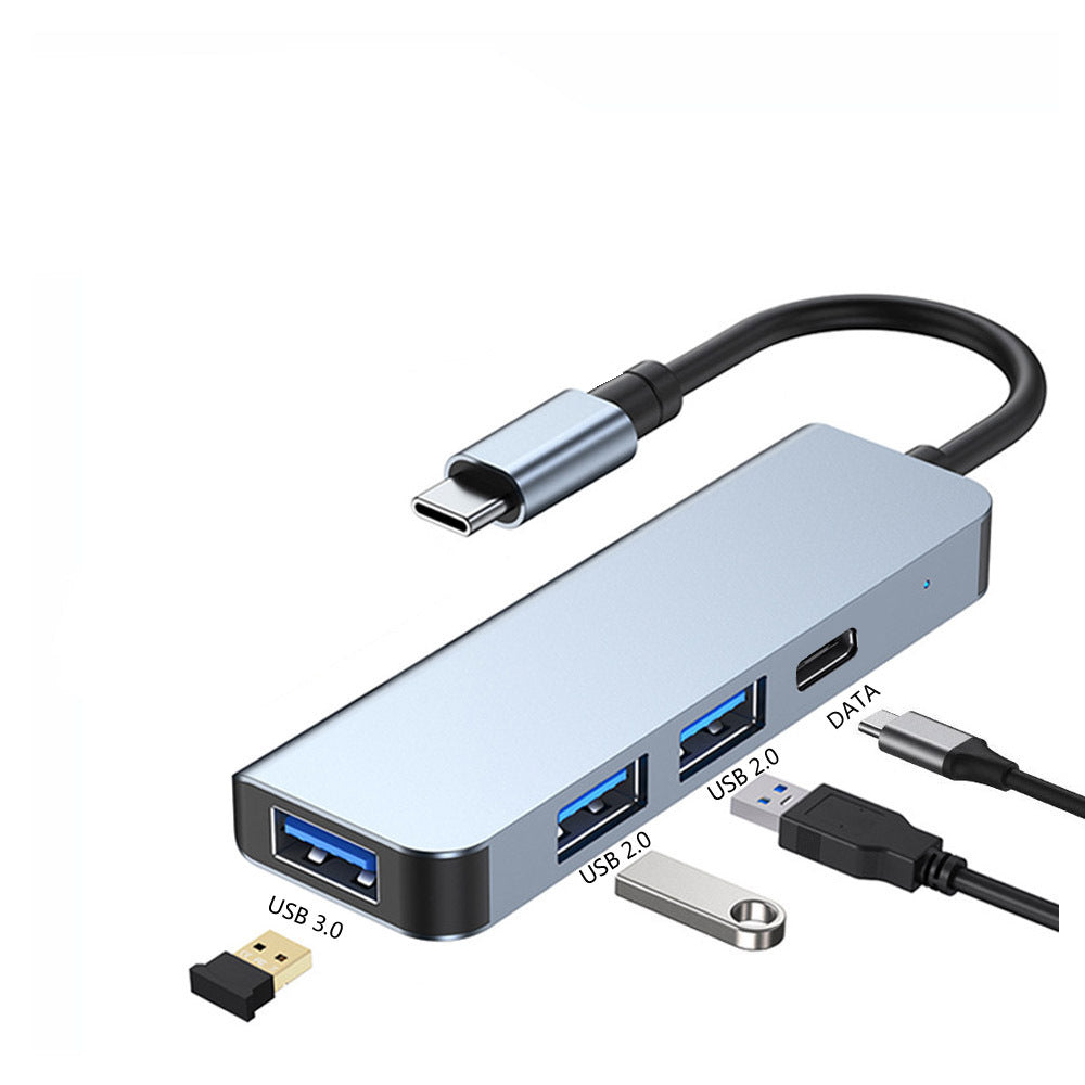 American Smart Type-C4-in-1 docking station with USB 3.0 ports and MacBook hub splitter, connected to a laptop with multiple devices