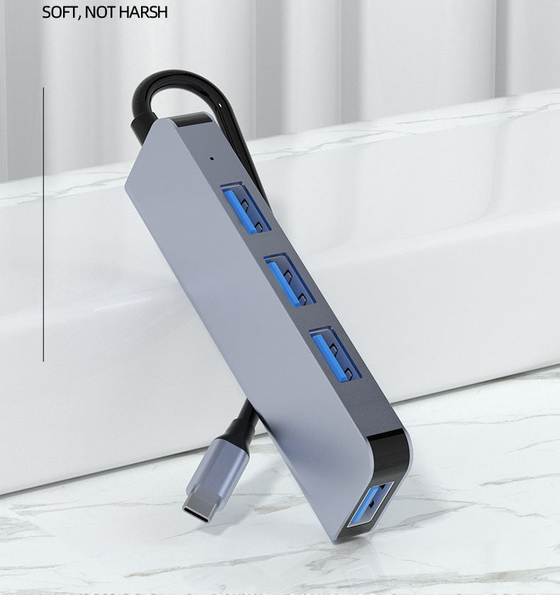American Smart Type-C4-in-1 docking station USB 3.0 hub for MacBook and laptops, showing multiple ports and sleek design.