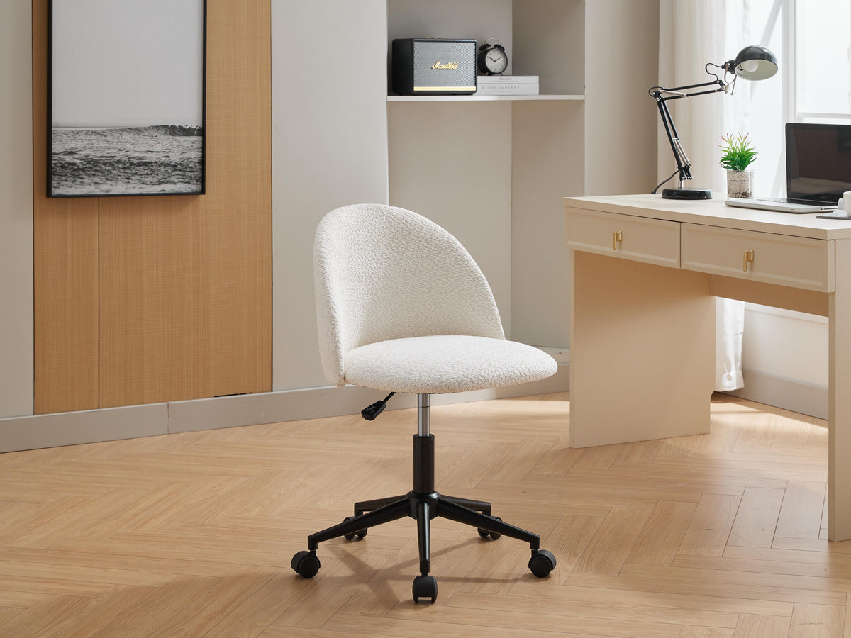 Black velvet fabric office chair with white cushioned seat, mid back, adjustable height, rotating wheels, and black legs.