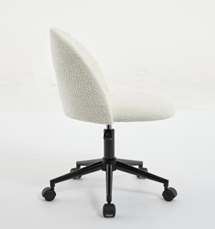 Black velvet fabric office chair with white cushioning, adjustable mid-back design, wheels, and black legs for comfortable seating.