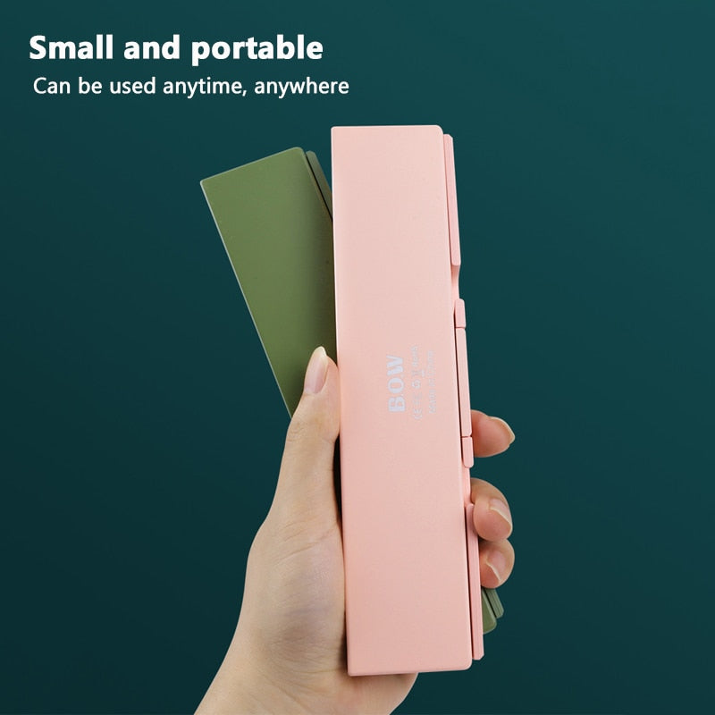 Wireless American Smart EP mini folding keyboard with Bluetooth, foldable design for laptop, tablet, and phone use.