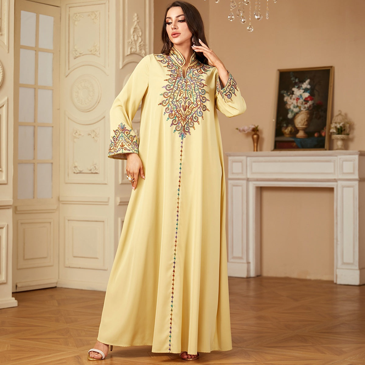 Embroidered Middle Eastern long Muslim robe with V-neck, traditional Arabic Dubai Jalabiya style, in vibrant fabric.