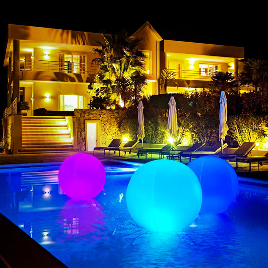 Solar-powered LED floating beach ball pool light with remote control by American Smart - SY, glowing in the water.