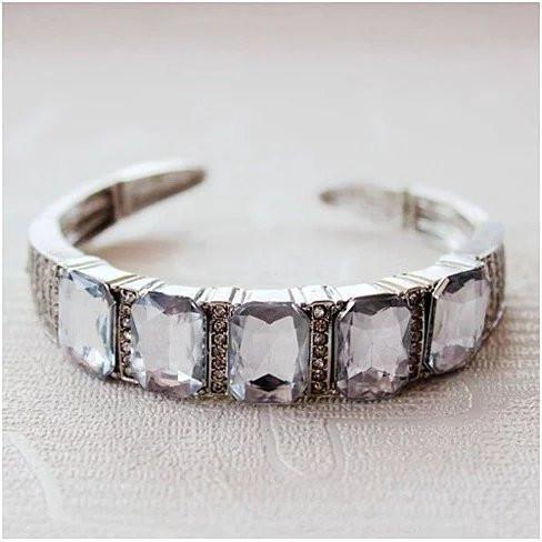 American Smart diamond crystal open-ended bracelet featuring sparkling diamond crystals and a sleek, modern design.