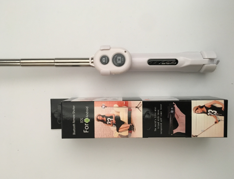 Stainless steel telescopic Bluetooth selfie stick with tripod functionality, designed for smartphones and camera accessories.