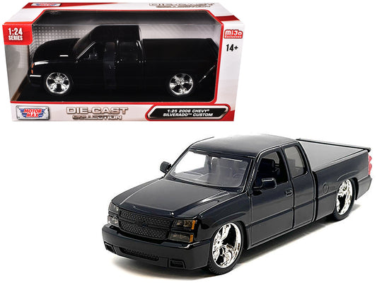 Black 2006 Chevrolet Silverado die-cast pickup truck model by Motormax, part of the Custom Pickup Series, detailed collectible car.