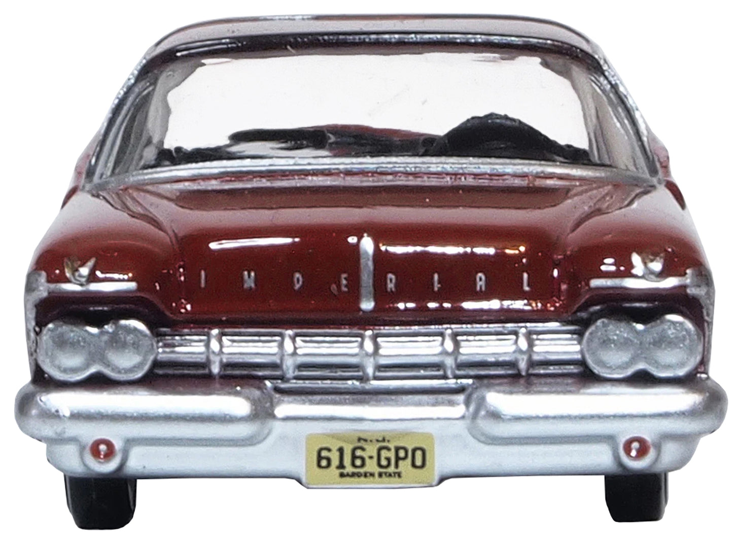 Radiant red 1959 Chrysler Imperial Crown 2-door hardtop diecast model car in 1/87 scale by Oxford Diecast with black roof.