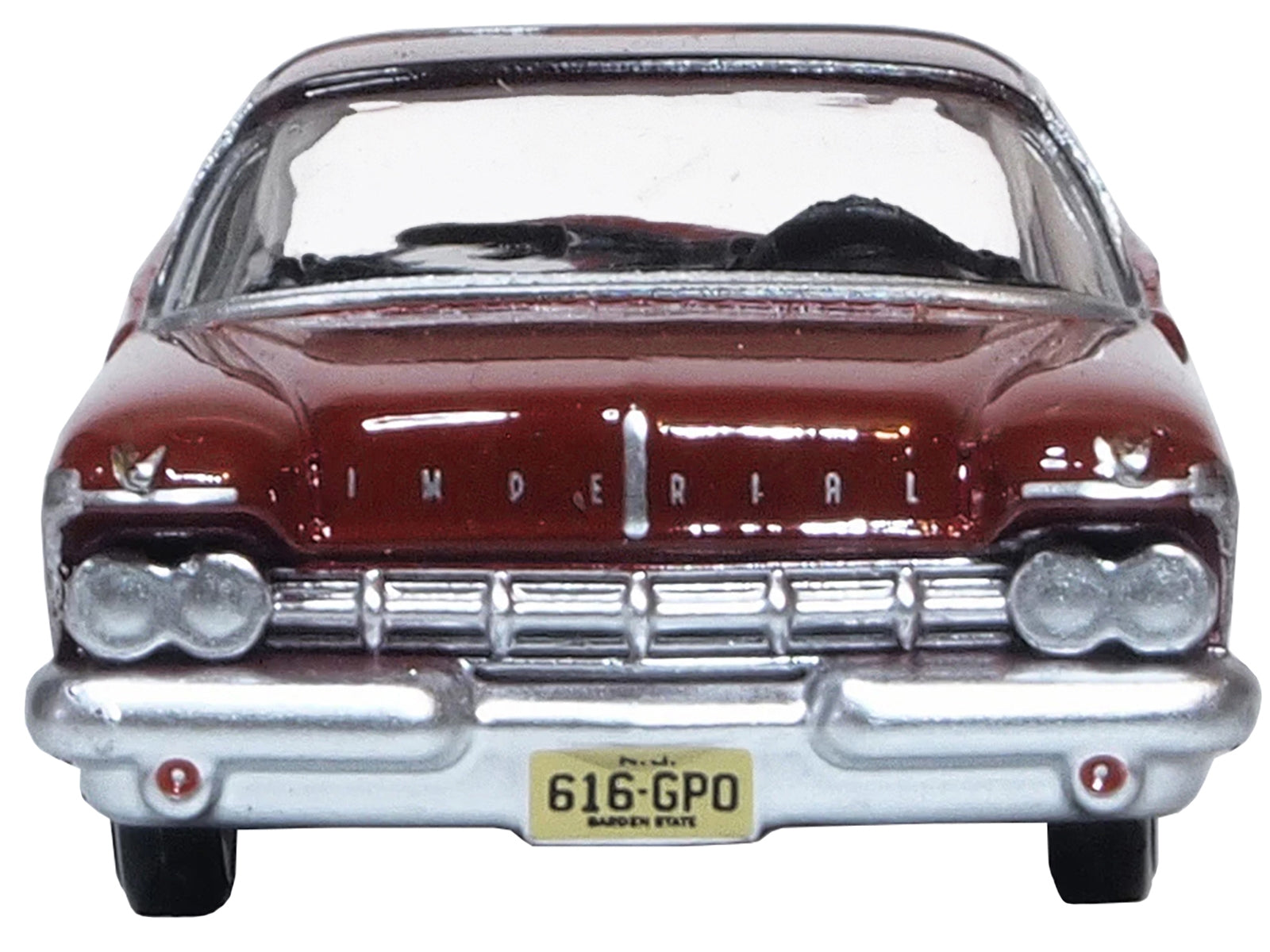 Radiant red 1959 Chrysler Imperial Crown 2-door hardtop diecast model car in 1/87 scale by Oxford Diecast with black roof.