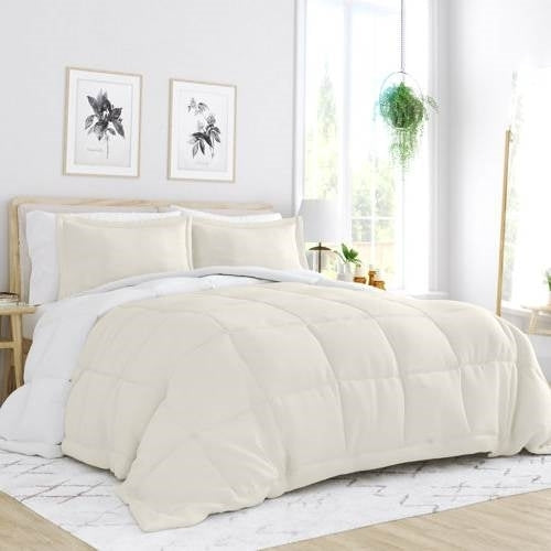 Full/Queen size American Smart microfiber reversible comforter set in white and cream with a soft, plush appearance and decorative stitching.