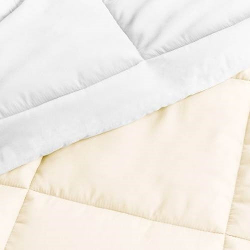 Full/Queen microfiber reversible comforter set in white and cream with matching pillow shams from American Smart WB.