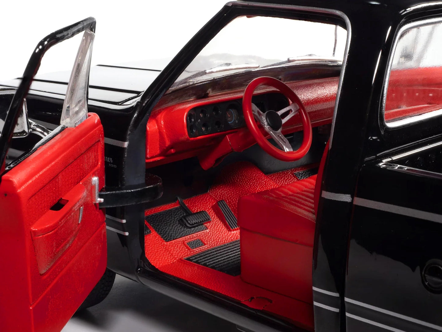 Black 1979 Dodge Adventurer Sweptline pickup truck diecast model by Auto World, with red interior, part of the American Muscle series.