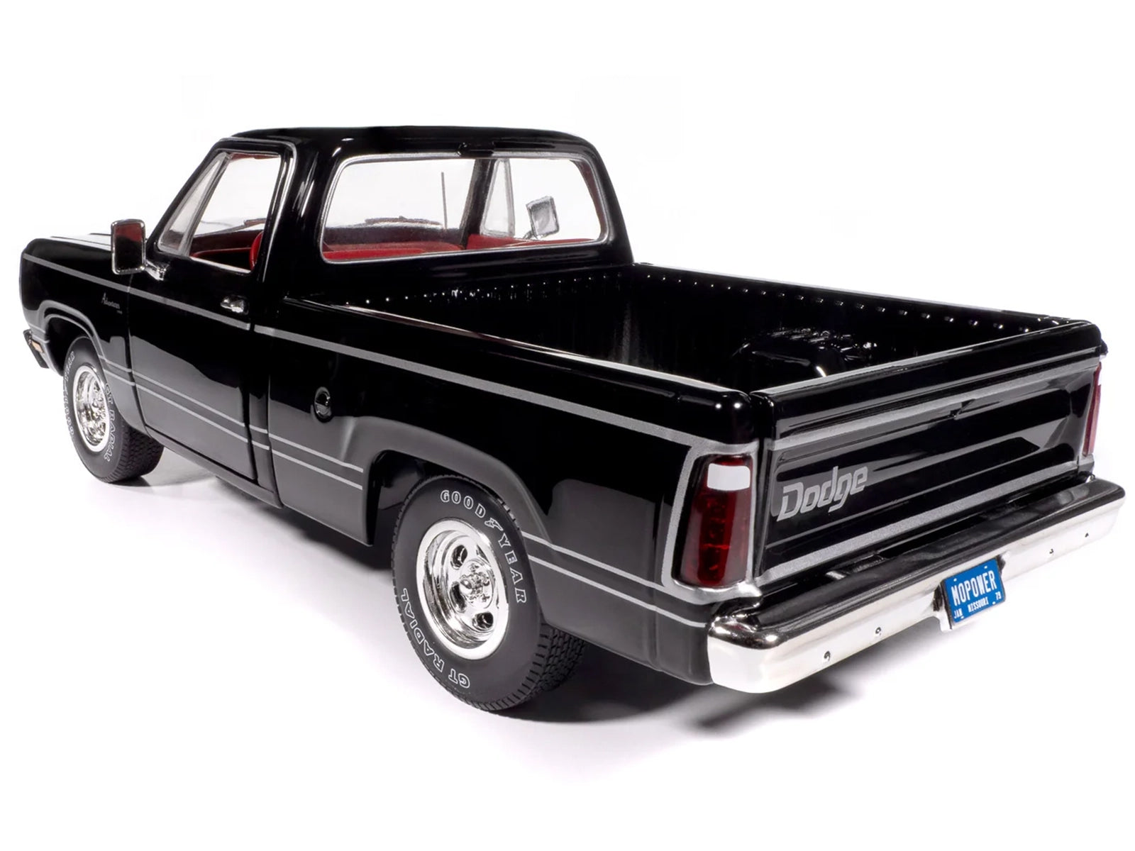 Black 1979 Dodge Adventurer Sweptline pickup truck diecast model with red interior, part of American Muscle Series by Auto World.