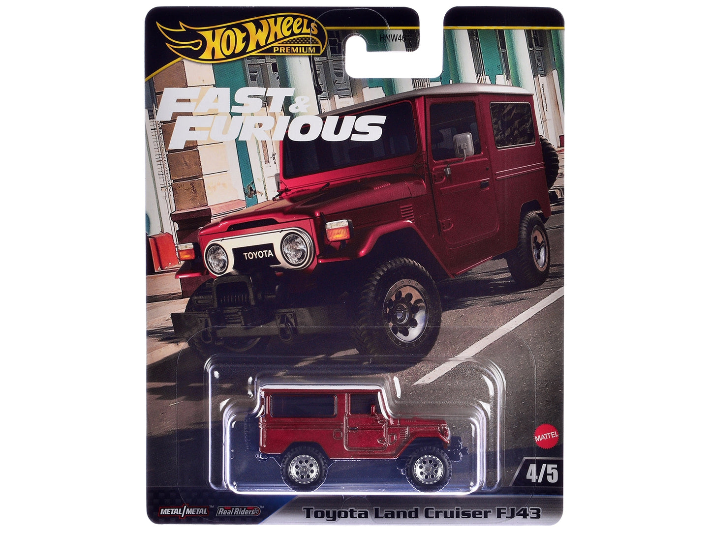 Red Toyota Land Cruiser FJ43 diecast model car from Fast & Furious series by Hot Wheels, featuring white top and detailed design.