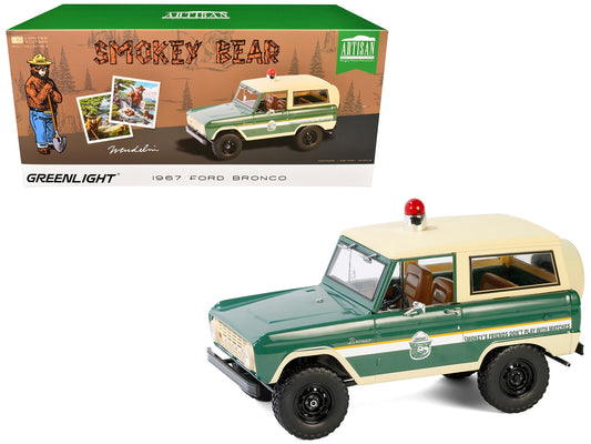 1967 Ford Bronco "Smokey Bear Forest Ranger" diecast model car in green and cream with white stripes by Greenlight, 1/18 scale.