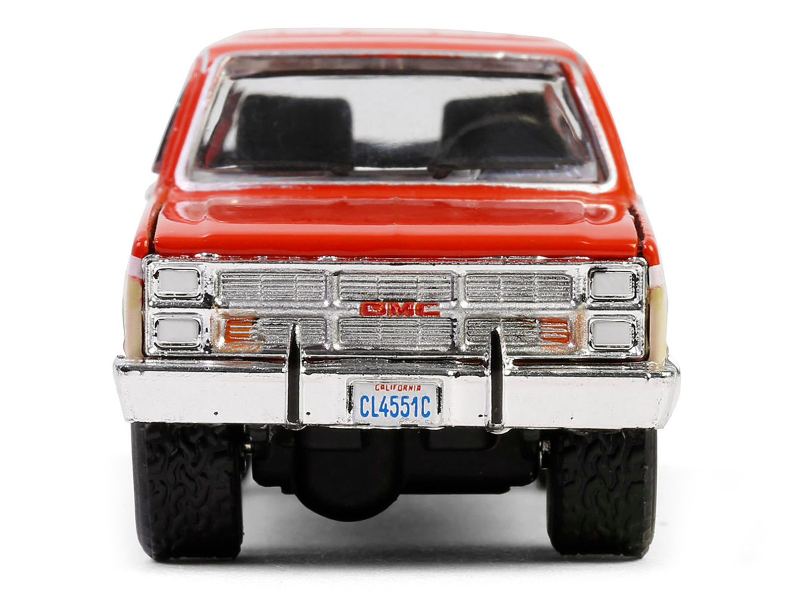 1988 GMC Suburban Sierra Classic C10 diecast model car in orange and beige with white stripes, part of Greenlight's Chevron Special Edition series.