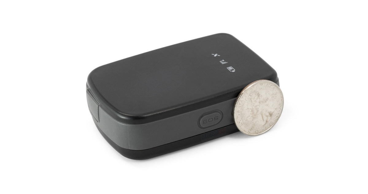 American Smart iTrack PUCK GPS tracker for motorcycles, compact device with GSM connectivity for real-time location tracking.