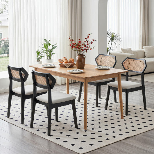 Set of two mid-century American Smart rattan dining chairs with black rattan backs and solid wood frames for kitchen or dining room.