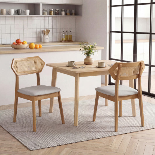 Set of two American Smart black mid-century rattan dining chairs with rattan backrests and solid wood frames for kitchen and dining area.
