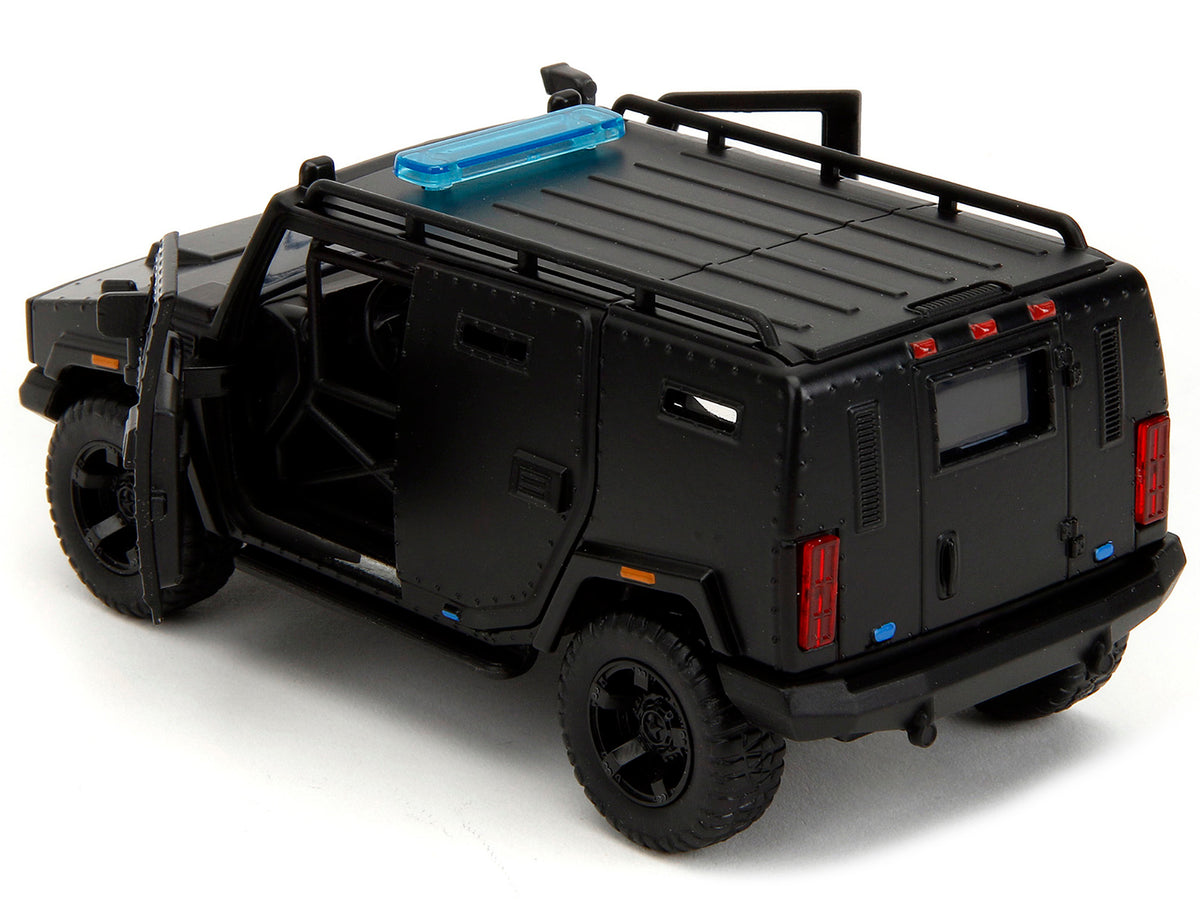 Black 1/32 diecast model of Agency SUV "Fast X" from Fast & Furious series by Jada, featuring detailed exterior design.