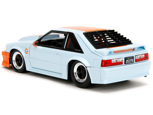 Light blue 1989 Ford Mustang GT "Gulf Oil" diecast model car with orange stripe, from Jada's Bigtime Muscle series.