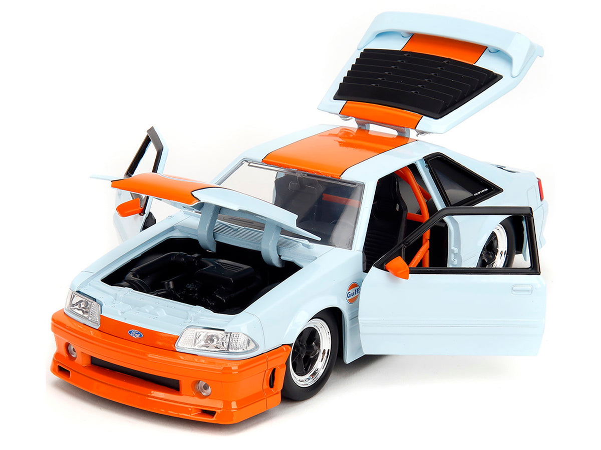 Light blue 1989 Ford Mustang GT "Gulf Oil" diecast model car with orange stripe, part of Jada's Bigtime Muscle series.