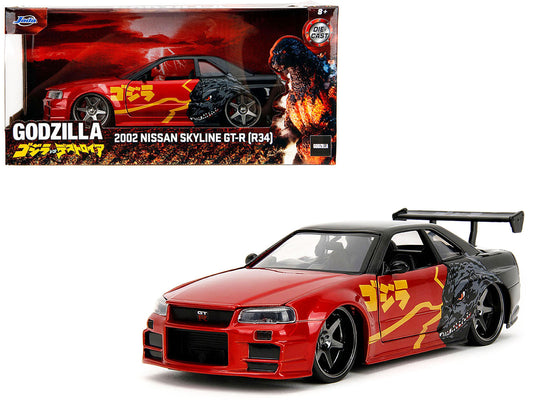 2002 Nissan Skyline GT-R R34 diecast model car in red metallic and black from Jada's Hollywood Rides series, detailed 1/24 scale.
