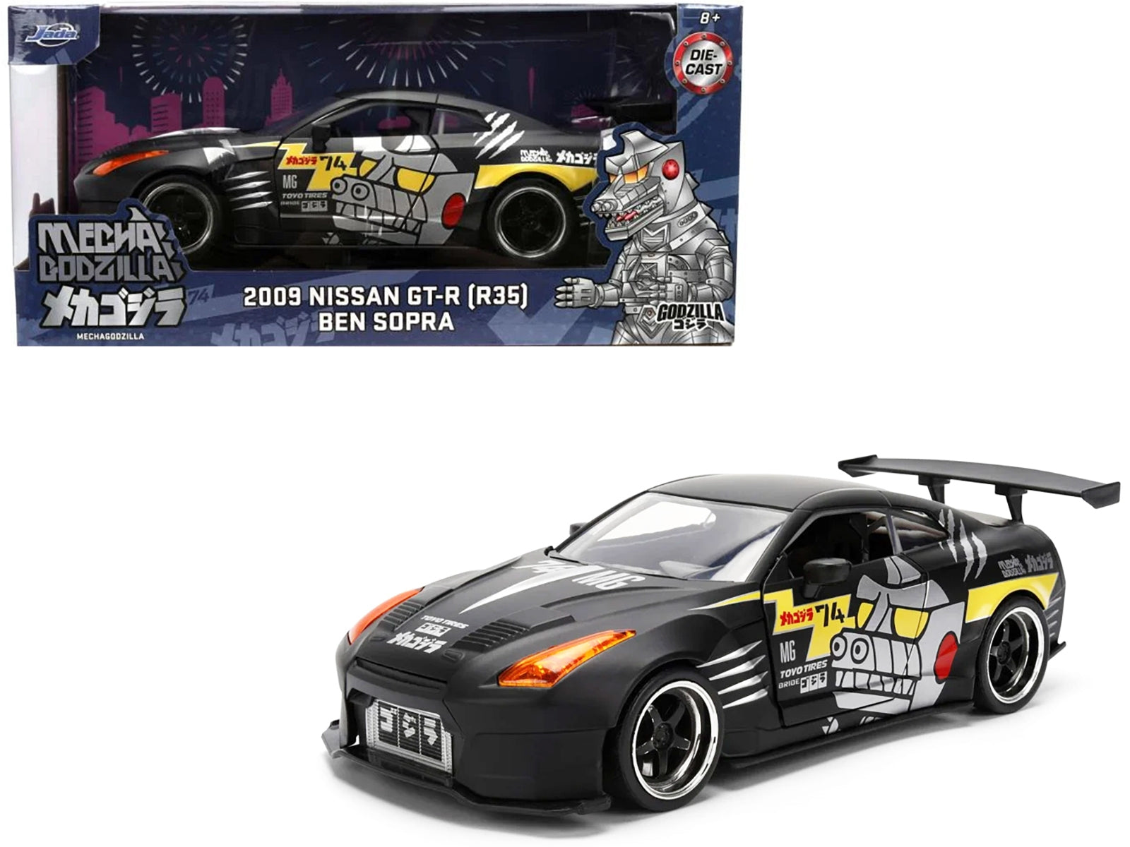 2009 Nissan GT-R R35 diecast model car by Jada, matte black with "Mechagodzilla" graphics, from Hollywood Rides series, American Smart.