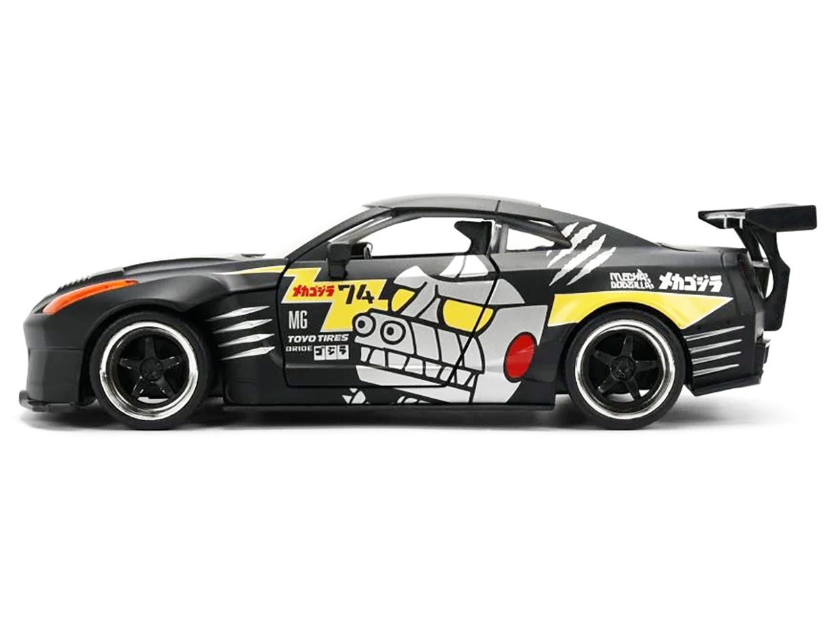 2009 Nissan GT-R (R35) Ben Sopra matte black diecast model car with "Mechagodzilla" graphics, part of Hollywood Rides series by Jada