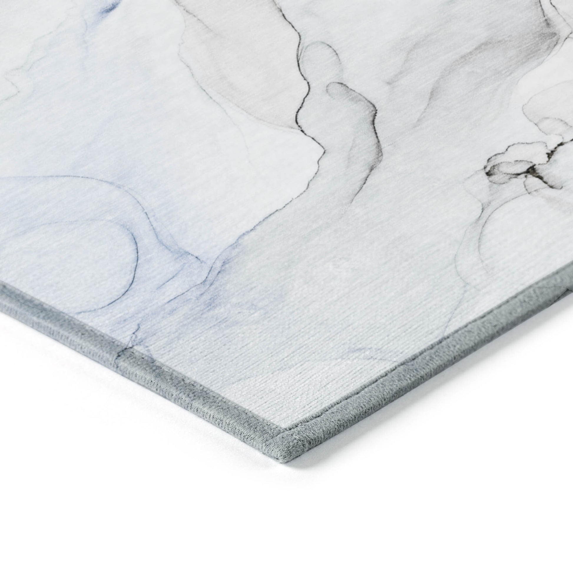 American Smart outdoor area rug featuring an ivory, blue, and gray abstract design, washable and non-skid for indoor and outdoor use.