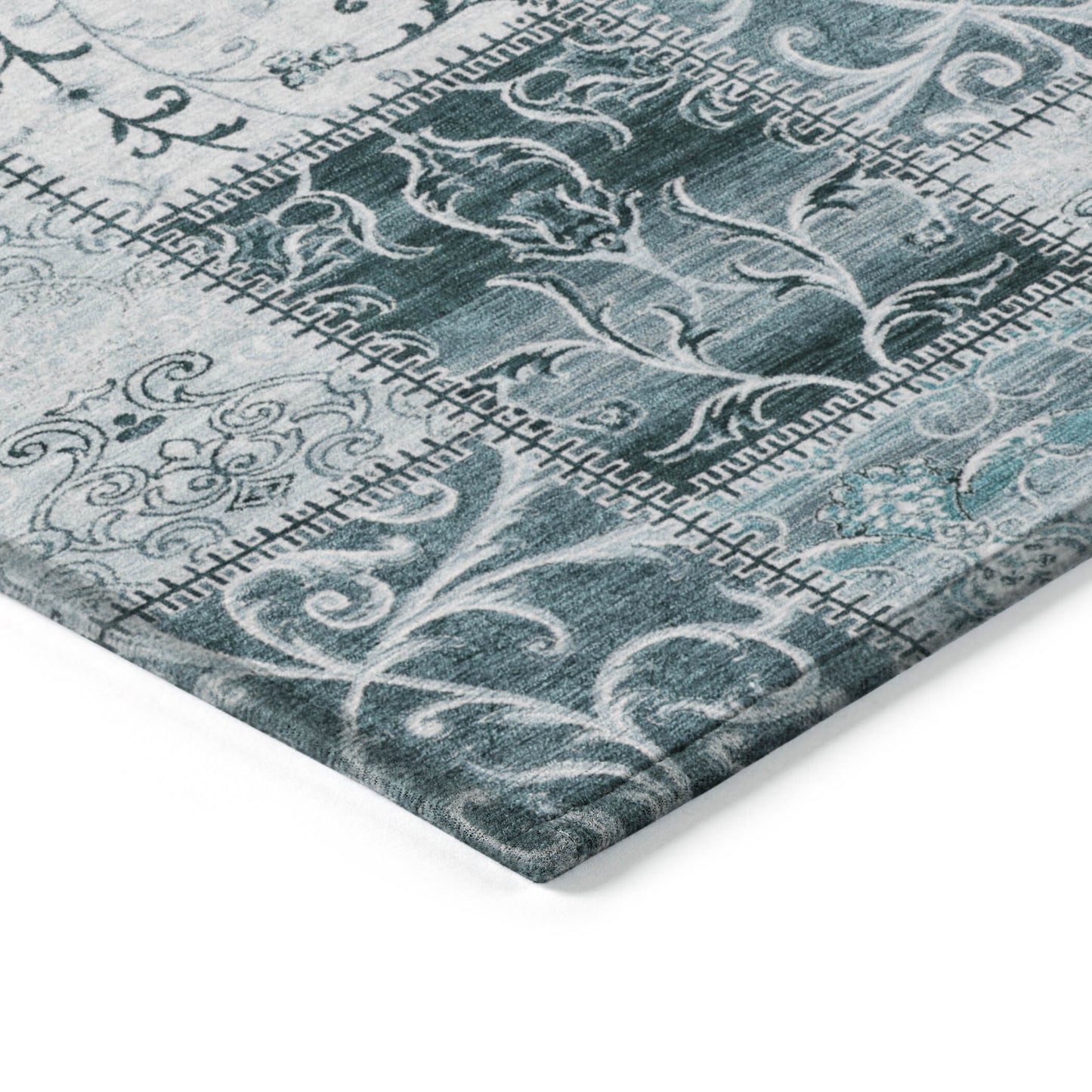 Teal patchwork outdoor area rug by American Smart, 3' x 5' washable non-skid indoor outdoor rug on a patio surface.