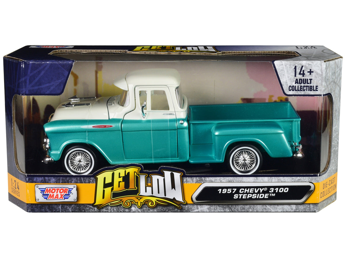 1957 Chevrolet 3100 Stepside Pickup Truck diecast model by Motormax in turquoise metallic and white, detailed interior, 1/24 scale.
