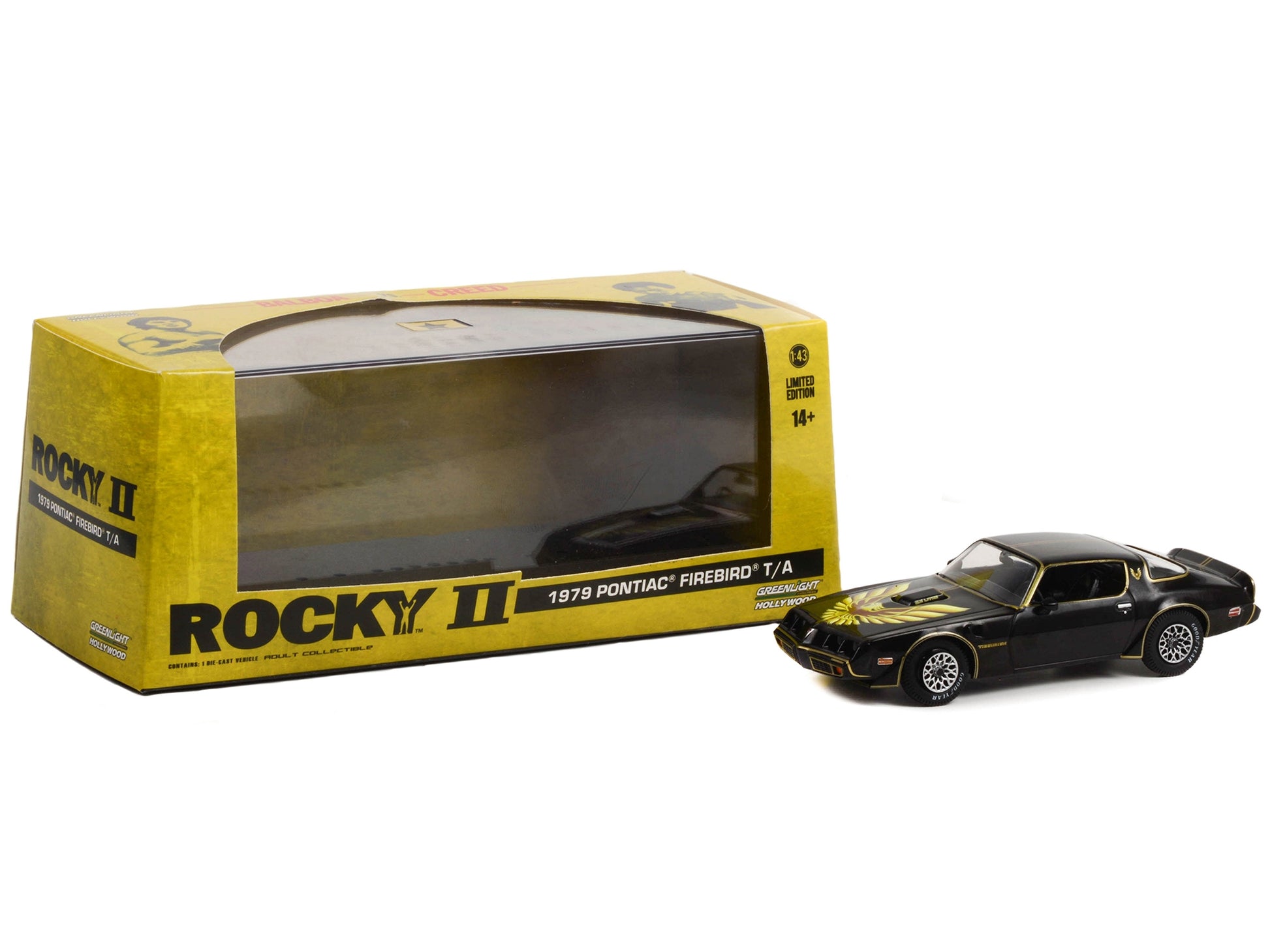 Black 1979 Pontiac Firebird T/A Trans Am diecast model car by Greenlight, featuring hood phoenix design from Rocky II movie.