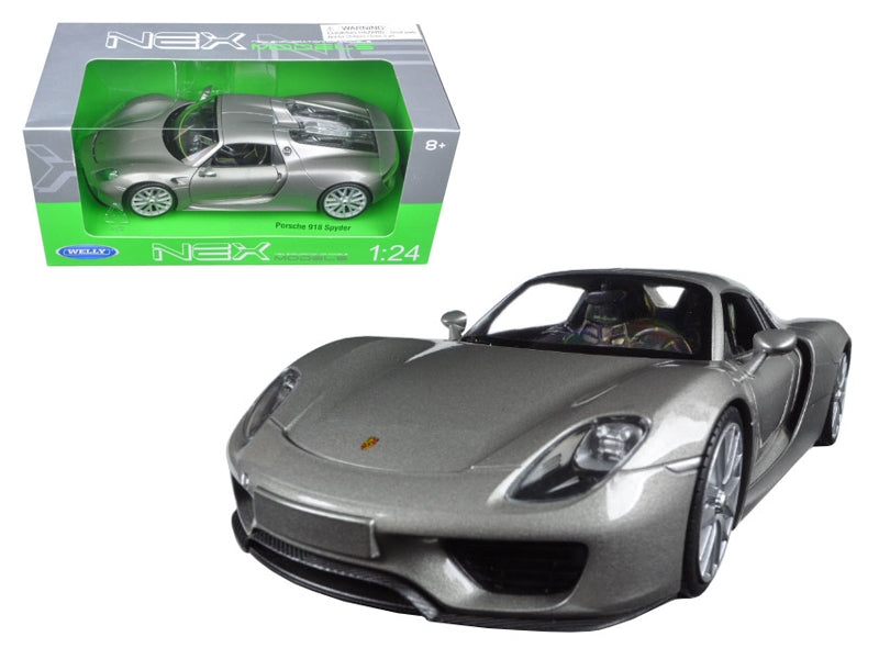 Silver Porsche 918 Spyder diecast model car by Welly, detailed 1/24 scale Porsche model with closed roof in a natural pose.