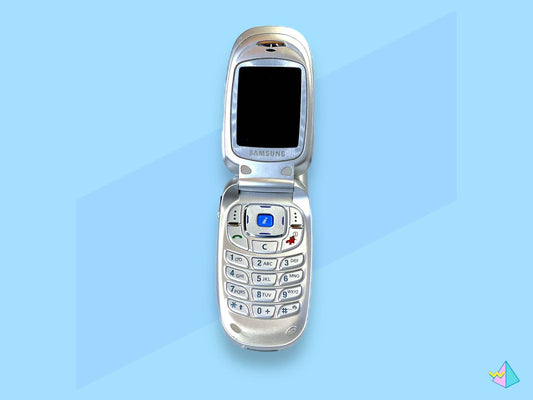 Vintage Samsung flip mobile phone by American Smart WB, showing the classic clamshell design and screen open.