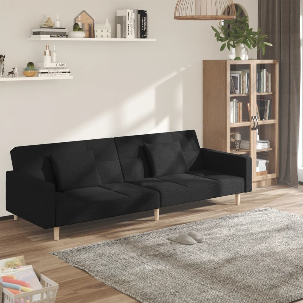 Black fabric 2-seater sofa bed with two pillows, American Smart WB, showcasing a modern design and comfortable seating.