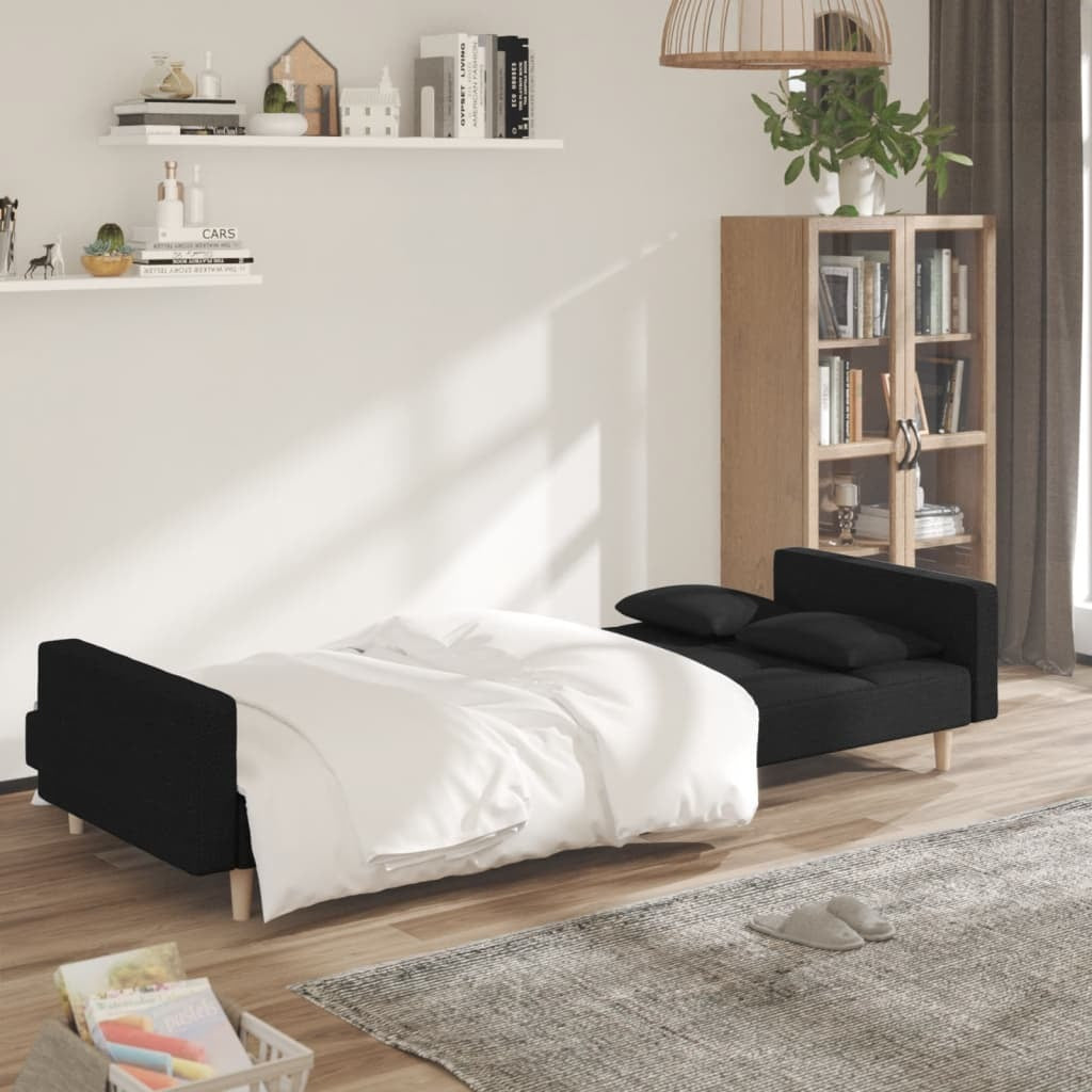 Black fabric 2-seater sofa bed with two pillows, modern American Smart - WB sofa shown in a living room setting.