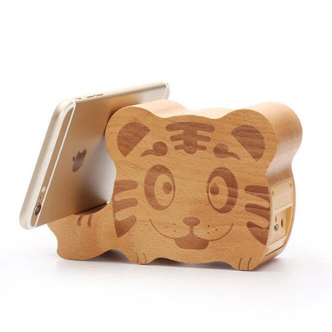 Woodsy Goodsy 2-in-1 Bluetooth speaker and cell phone stand by American Smart WB, showing the stylish wooden design and device setup.