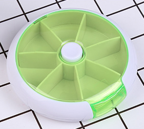 Round portable rotating medicine box with seven compartments, American Smart WB storage bottle for organized medication storage.