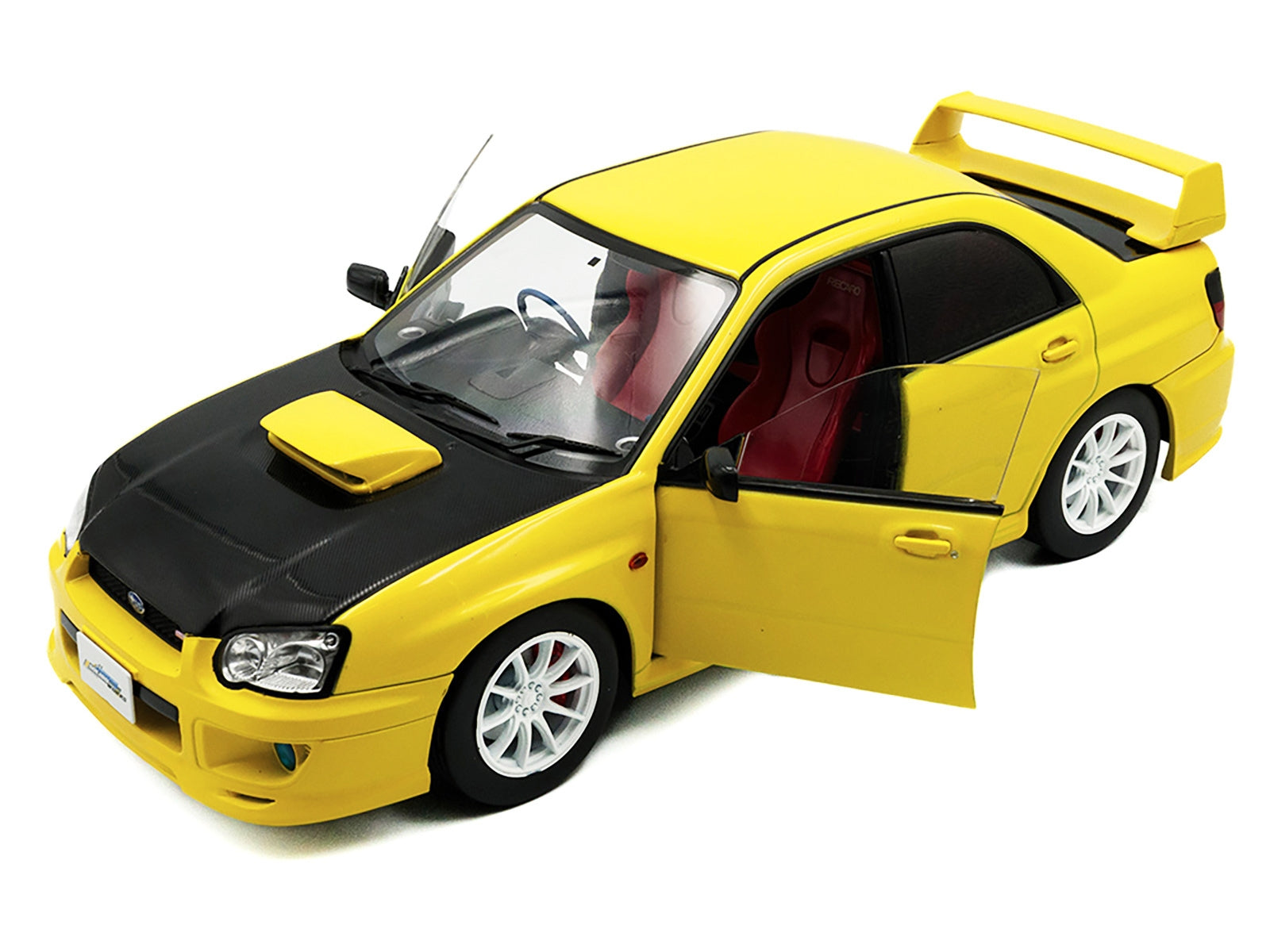 Yellow 2003 Subaru Impreza WRX STI RHD diecast model car by Solido, with carbon hood, detailed 1/18 scale display.