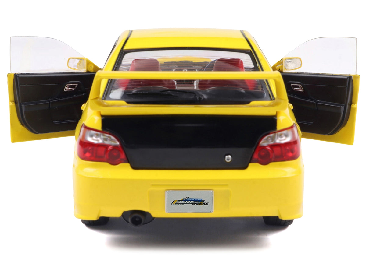 Yellow 2003 Subaru Impreza WRX STI RHD diecast model car by Solido, featuring a carbon hood, detailed American Smart WB Subaru model.