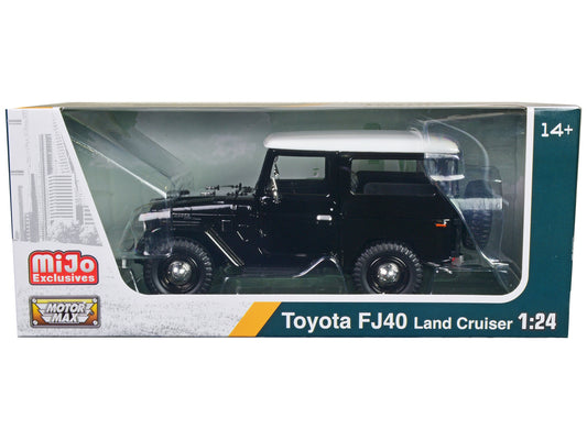 Black Toyota FJ40 Land Cruiser diecast model car with white top, 1/24 scale by Motormax, detailed toy vehicle.