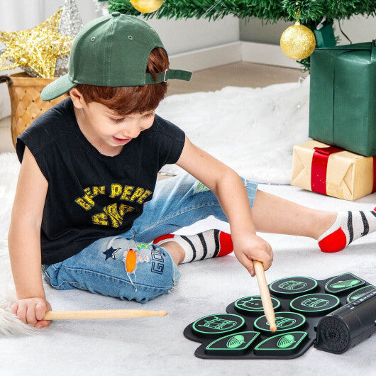 Green electronic drum set for kids by American Smart with built-in stereo speakers, colorful toy musical instrument.