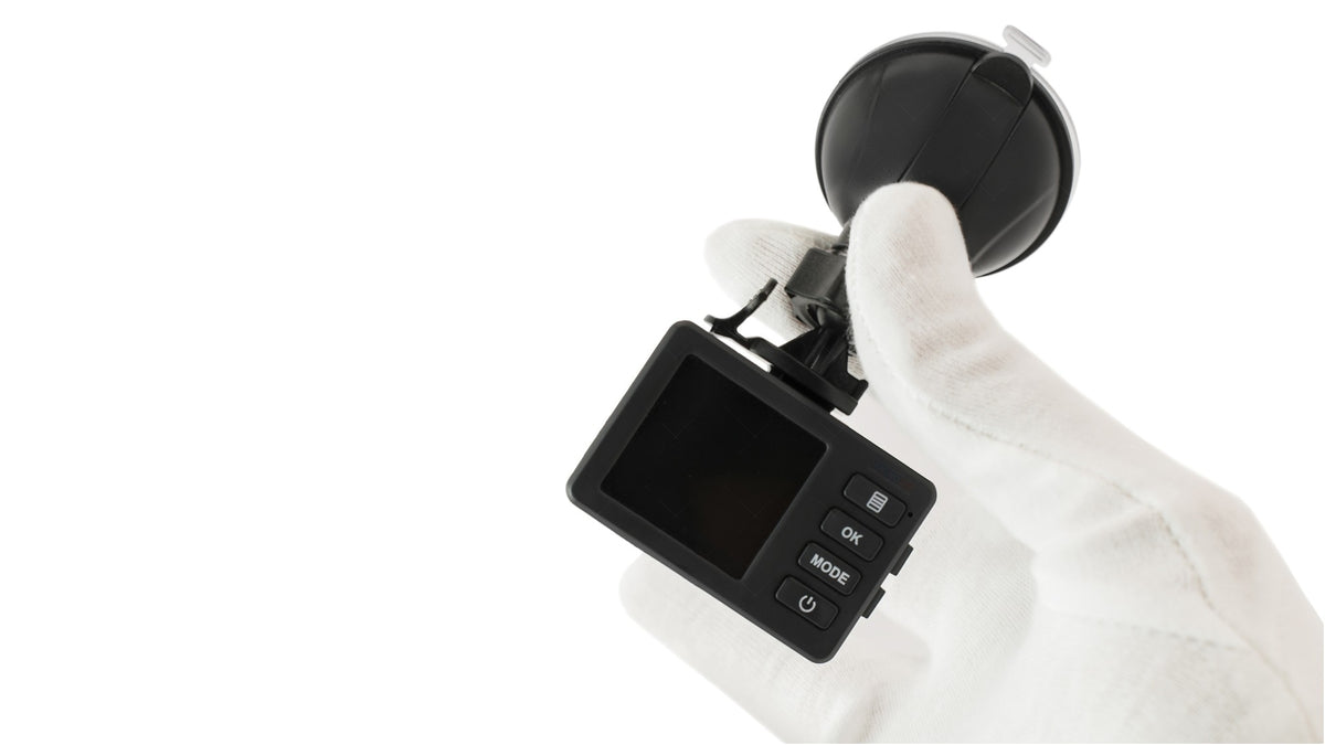 American Smart WB iDrive DVR camera displaying video footage on in-dash LCD screen in a vehicle.