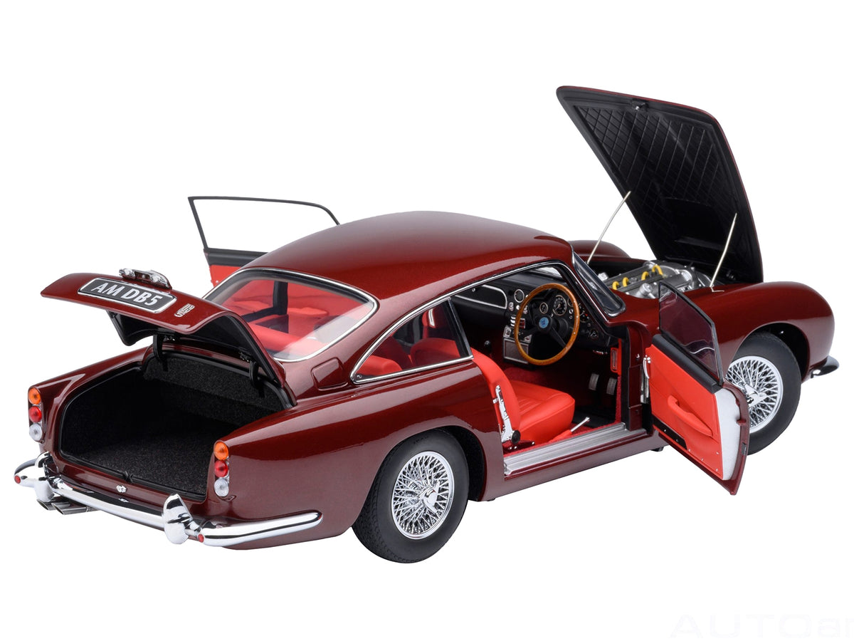 Autoart Aston Martin DB5 RHD model car in Dubonnet Rosso Red metallic finish, 1/18 scale, detailed right-hand drive collectible.