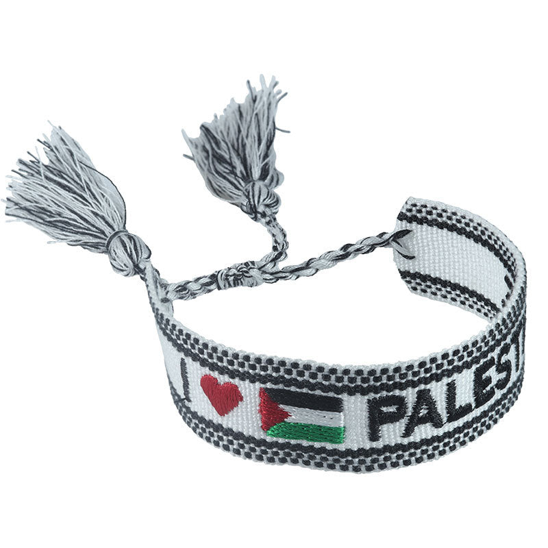 Embroidered Eiffel Tower woven wrist strap with Paris-themed design, ethnic style bracelet for sports and souvenirs from France.