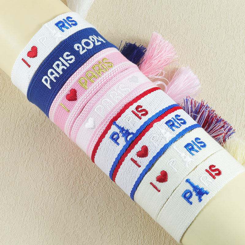 Embroidered Eiffel Tower woven wrist strap by eprolo featuring Paris-themed design, ideal for sports events and souvenirs from France.