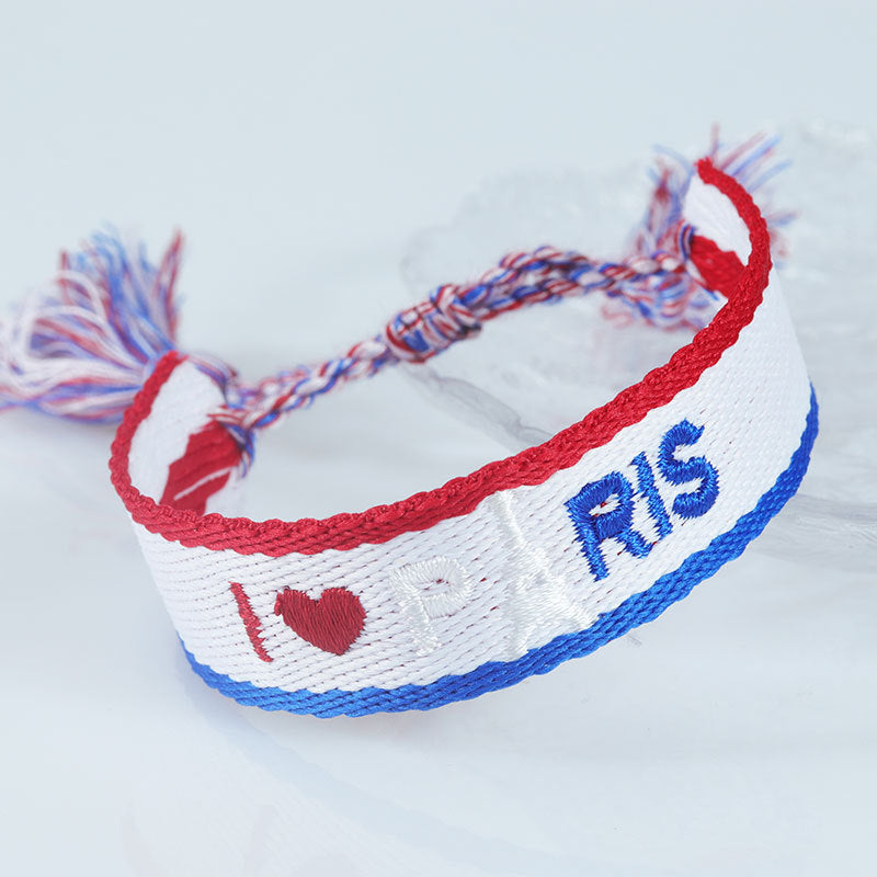 Embroidered Eiffel Tower woven wrist strap featuring French design, ideal for sports games and souvenirs from France.