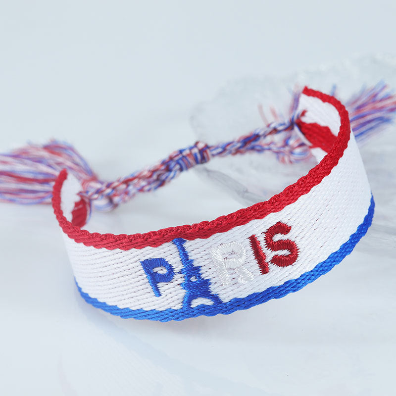 Embroidered Eiffel Tower woven wrist strap with ethnic style, souvenir from France, featuring Paris-themed design and colorful details.