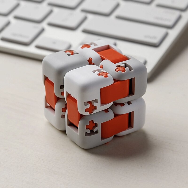 Original Xiaomi Mitu Spinner finger toy, smart portable toy for kids, showcasing colorful spinning bricks and compact design.