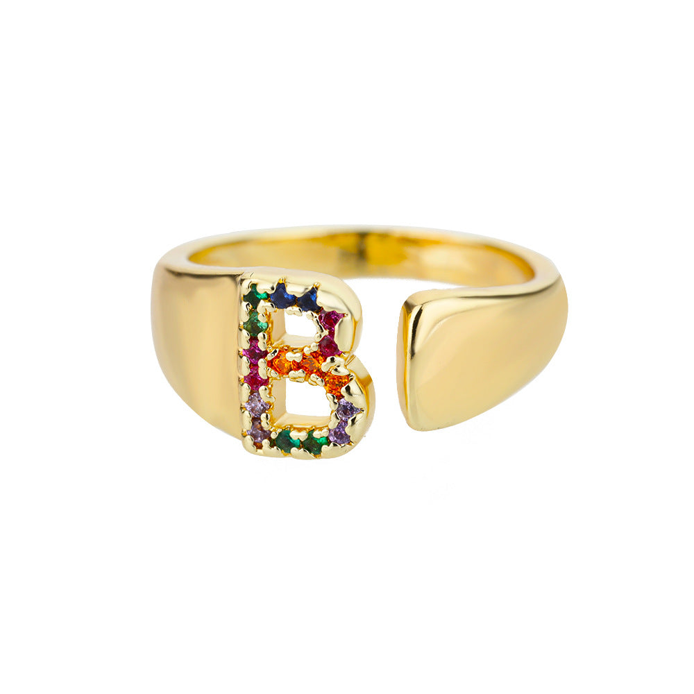 18K gold plated micro pave zircon letter ring with open design, featuring colorful gemstones and individual letter detail.